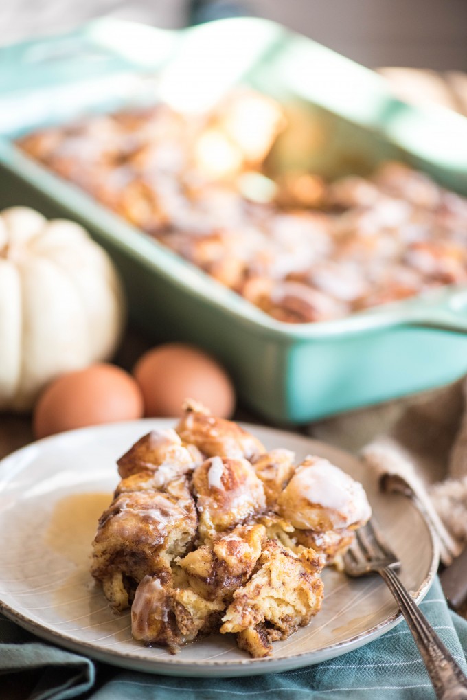 Slice of pumpkin cinnamon roll french toast casserole on a plate