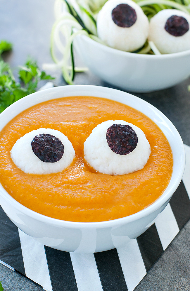 Monster mash soup with two eyes in a white bowl