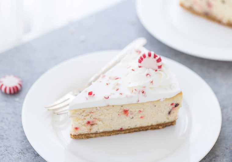 A slice of peppermint cheesecake on a white plate - christmas desserts