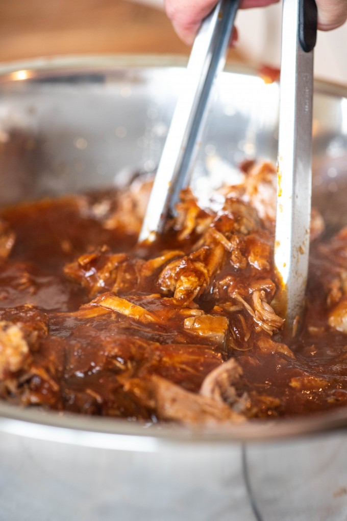 Instant Pot pulled pork simmering in BBQ sauce