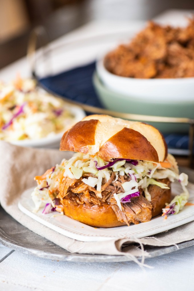 Instant Pot pulled pork sandwich on a white plate