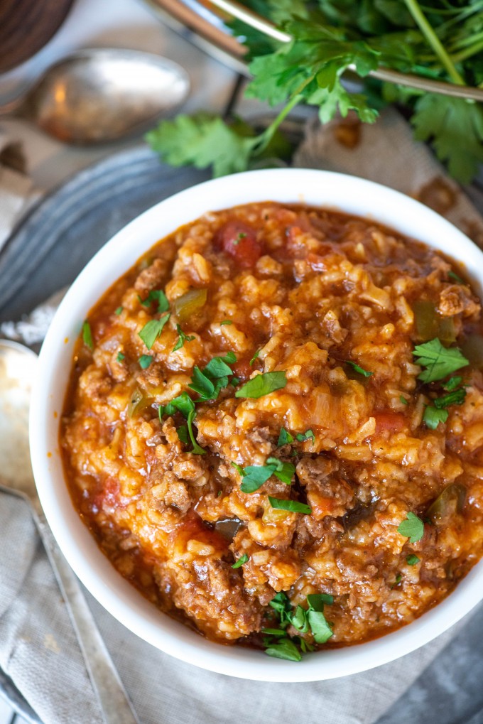 Overhead view of stuffed pepper soup in a white bowl