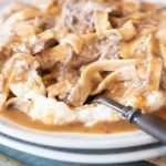 Close up of Instant Pot Beef and Noodles with fork on plate