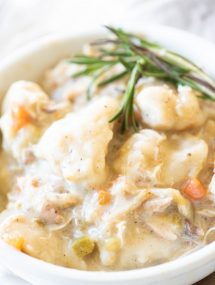 Close up of best instant pot chicken and dumplings in a white bowl