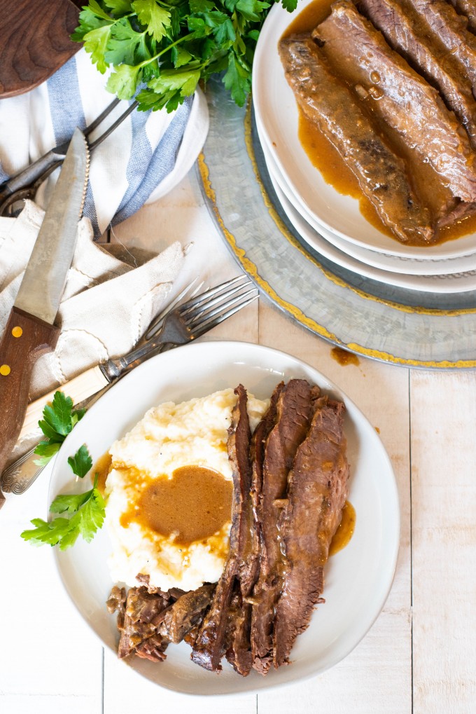 Overhead view of a plate of instant pot brisket with mashed potatoes