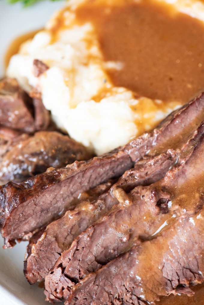 Close up of instant pot brisket with mashed potatoes