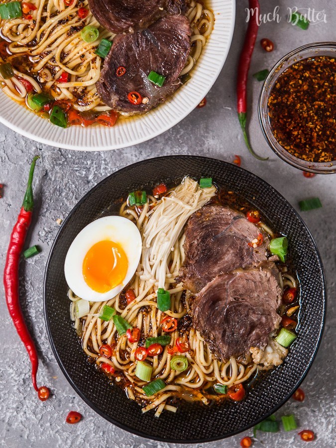 beef ramen topped with scallions and an egg