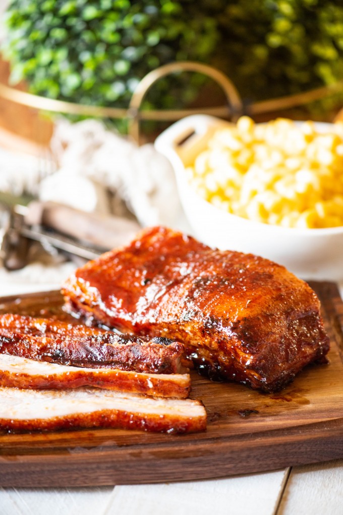 BBQ Smoked Pork Belly sliced on a cutting board