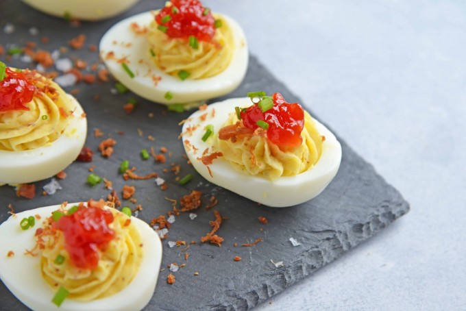 Boiled egg recipes - deviled eggs topped with tomato jam