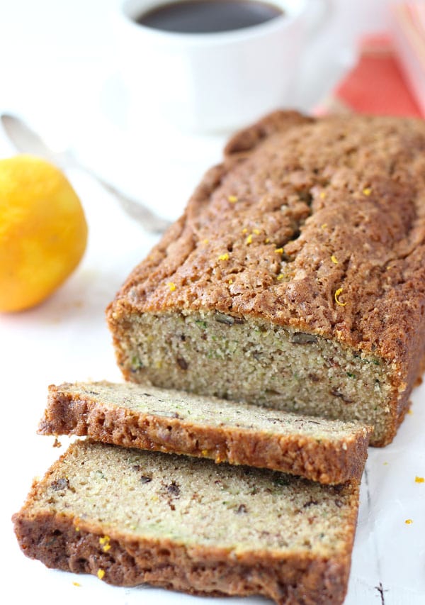 Close up of sliced orange zucchini bread