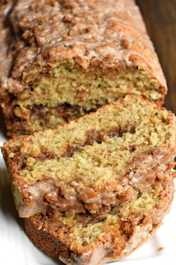 Close up of a sliced loaf of cinnamon zucchini bread