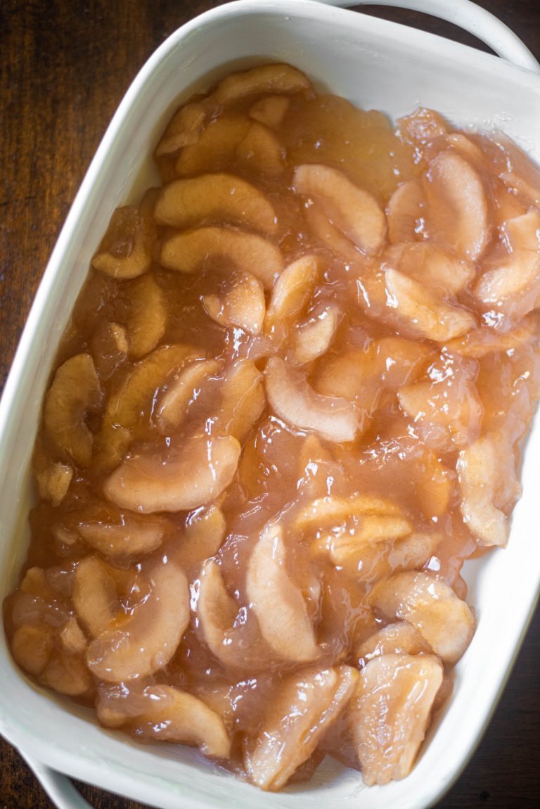 Canned apples in a white baking dish