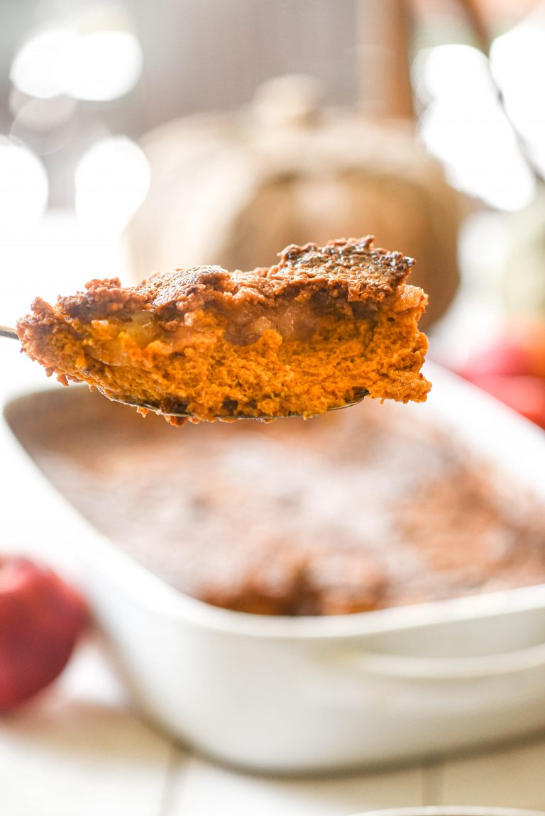 Slice of Apple Pumpkin Dump Cake on a serving spoon