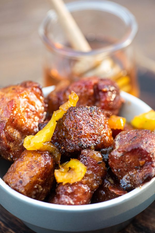 Pork belly burnt ends in a white bowl