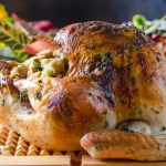 Thanksgiving Herb Roasted Turkey on a cutting board