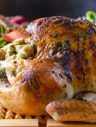 Thanksgiving Herb Roasted Turkey on a cutting board