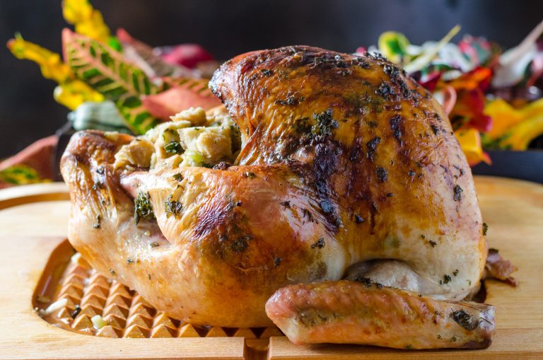 Thanksgiving Herb Roasted Turkey on a cutting board