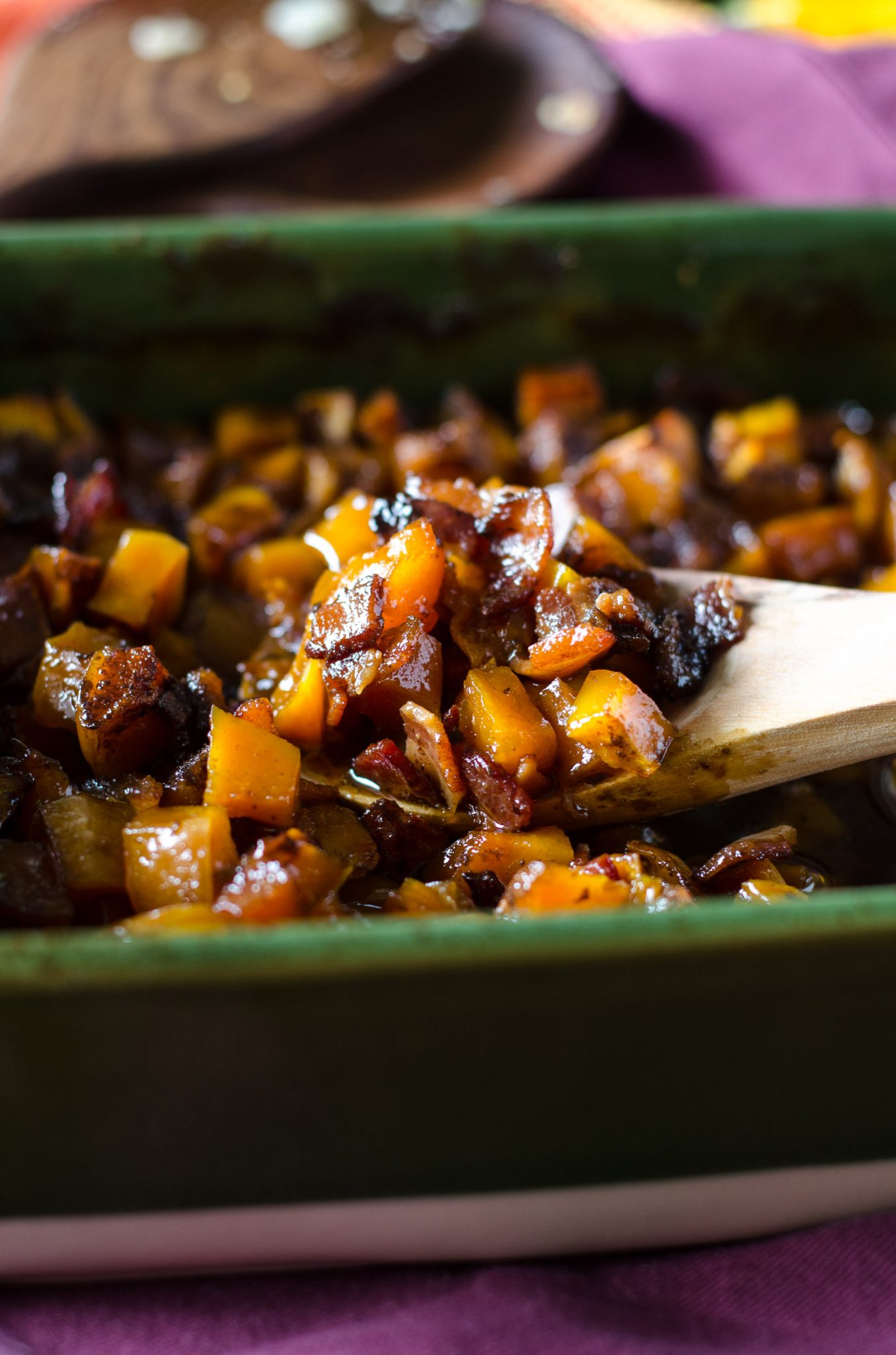 Bourbon bacon brown sugar butternut squash in a green baking dish