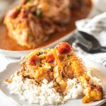 Instant Pot Chicken Cacciatore over rice on a white plate