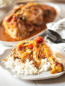 Instant Pot Chicken Cacciatore over rice on a white plate