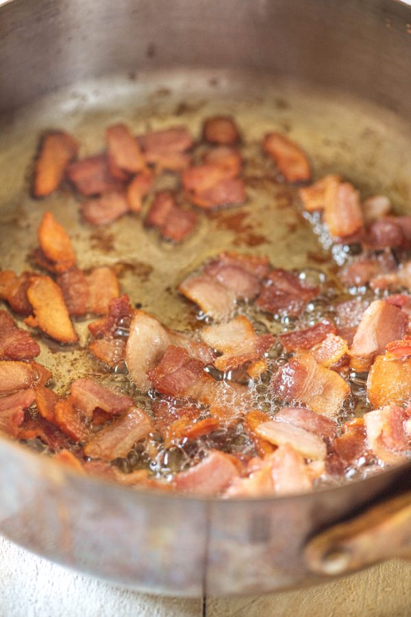 Bacon frying in a pan