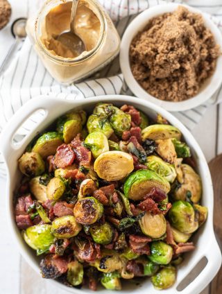 Overhead view of stovetop brussels sprouts in a white bowl