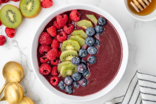 overhead shot of acai bowl topped with fruit